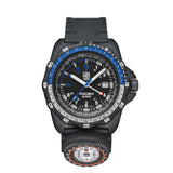 Front view of the Luminox RECON Nav Spec Men's 46mm Quartz GMT Watch XL.8833 with a black dial, white 12 and 24-hour numerals and blue accents. This RECON Nav Spec watch features a black CARBONOX™ case, a two-tone rotating bezel and a black rubber strap with a detachable compass.