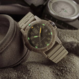 Luminox Leatherback SEA Turtle Giant Men’s 44mm Quartz Watch XS.0326 shown in a desert outdoor setting. This Leatherback SEA Turtle Giant watch features a monochromatic sand design, a lightweight CARBONOX™ case and 100m water resistance.