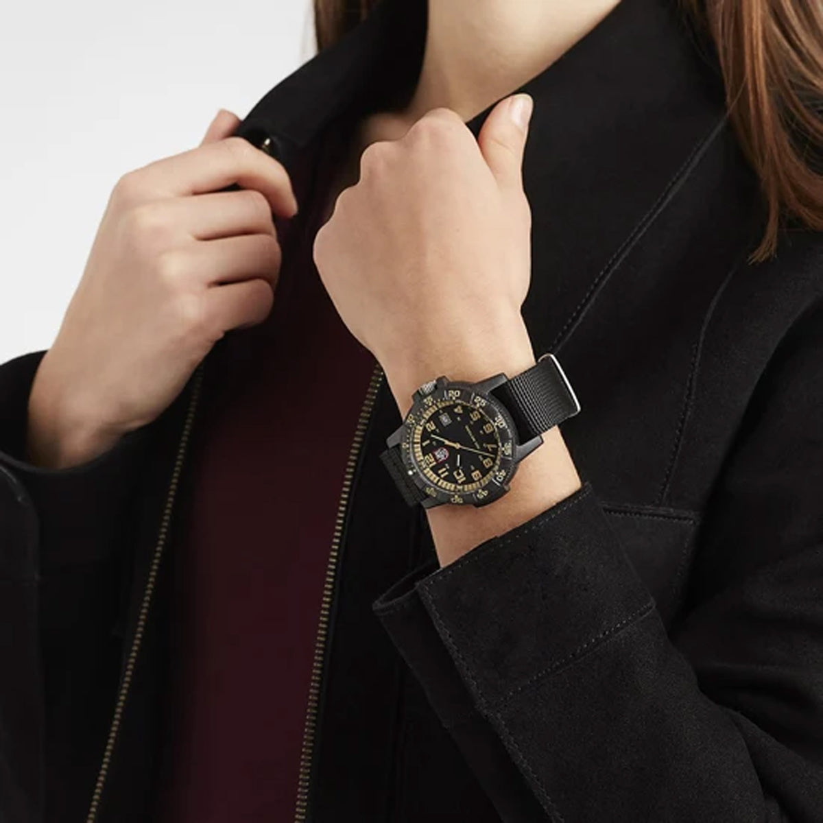 Luminox Leatherback SEA Turtle Giant Men's 44mm Quartz Watch XS.0333 shown in a rugged outdoor setting. This Leatherback SEA Turtle Giant watch features a black and beige dial, a lightweight CARBONOX™ case and 100m water resistance.