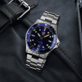 Luminox Sport Timer Men's 40mm Quartz Watch XS.0943 shown in a relaxed everyday setting. This Sport Timer 0940 Series watch features a blue sunray dial, a stainless steel case and 100m water resistance.