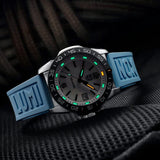 Luminox Pacific Diver Ripple Men's 39mm Quartz Watch XS.3124M shown in a coastal outdoor setting. This Pacific Diver Ripple dive watch features a blue mother-of-pearl dial, a stainless steel case and 200m water resistance.