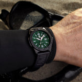 Luminox Pacific Diver Men's 44mm Quartz Watch XS.3137.B worn on the wrist to show its size and fit. This Pacific Diver 3120 Series watch features an emerald green sunray dial, a black CARBONOX™ dive bezel and a black IP stainless steel case on a black rubber strap.