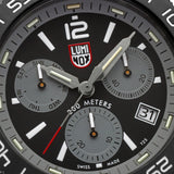 Close-up of the graphite grey dial on the Luminox Pacific Diver Chronograph Men’s 44mm Quartz Watch XS.3148, showing the three chronograph sub-dials, luminous hands and markers, and date window. This Pacific Diver Chronograph features self-powered tritium tubes for constant visibility in the dark.