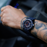 Luminox Navy SEAL Red Bull Ampol Racing Edition Men's 46mm Quartz Watch XS.3501.ARB.N worn on the wrist to show its size and fit. This limited edition Navy SEAL 3500 Series watch features a blue dial, a blue rotating dive bezel and a lightweight CARBONOX™ case.