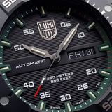 Close up of a Black and green Luminox Watch dial