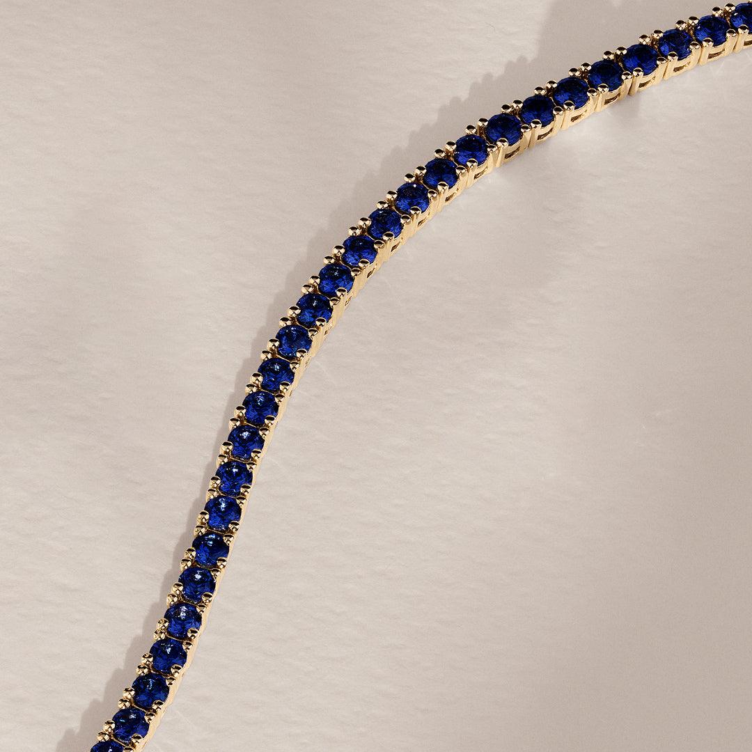 Created Sapphire Tennis Bracelet in 9ct Yellow Gold - Wallace Bishop
