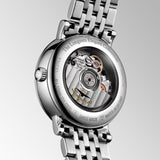 Close-up of the Longines Elegant 29mm case back, showing the smooth polished steel surface and detailed engravings including the model reference L4.310.4. The robust case construction provides water resistance to 3 bar while maintaining an elegantly slim profile.