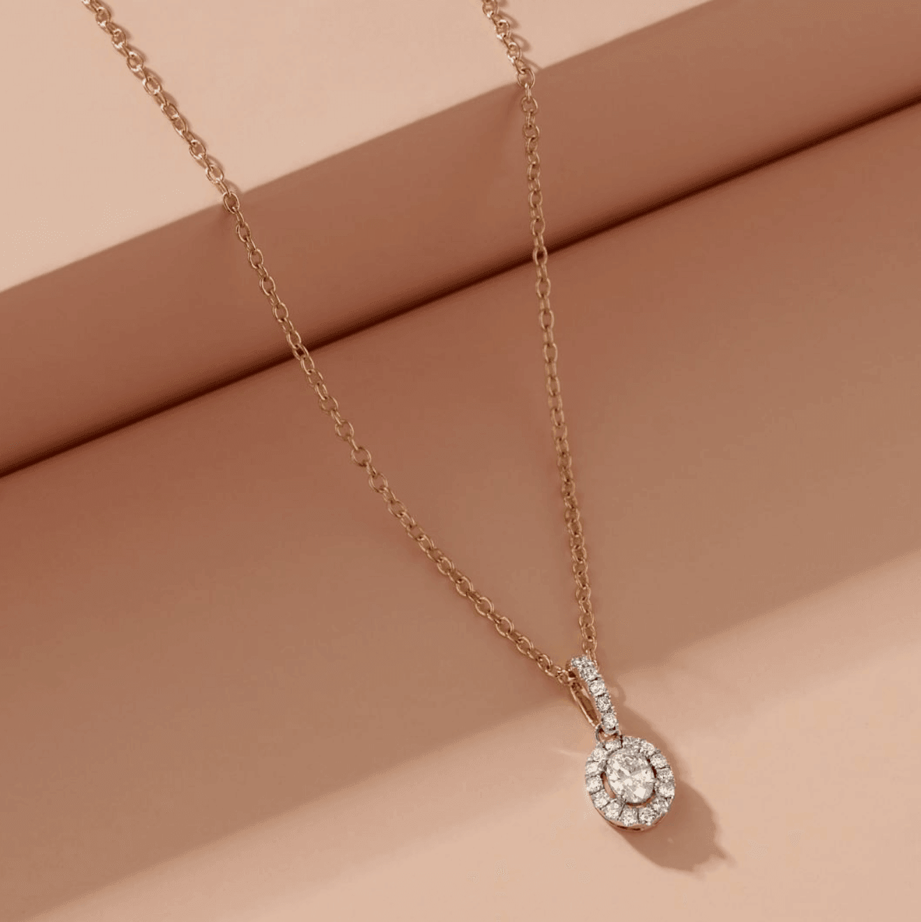 Oval Halo Diamond Pendant in 9ct Yellow and White Gold TGW 0.50ct - Wallace Bishop