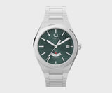  The Timex Q Continental GMT TW2Y24800 features a verdant green dial with radial texture and faceted hour markers. A GMT window sits at 6 o'clock, with a date window beside the 3rd hour marker.