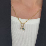 Video of a neck wearing a Wallace Bishop Charm Holder Chain in 9ct Yellow Gold, 500mm (approximately 19.7 inches) in length, with two Double Bezel Pendants in 9ct Yellow Gold added to it: the Pear-Cut Swiss Blue Topaz Pendant, reference 93PDPSST1Y, and the 0.30 TDW Round Lab-Grown Diamond Pendant, reference LGNDBR30.