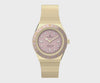 This angle highlights the luminant markers and the stationary top ring. The gold-tone case catches the light across its compact, polished silhouette.