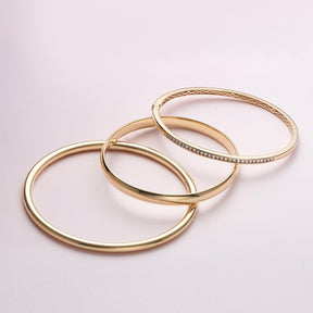 Round Brilliant Cut Channel Set Diamond Oval Bangle in 9ct Yellow Gold - Wallace Bishop
