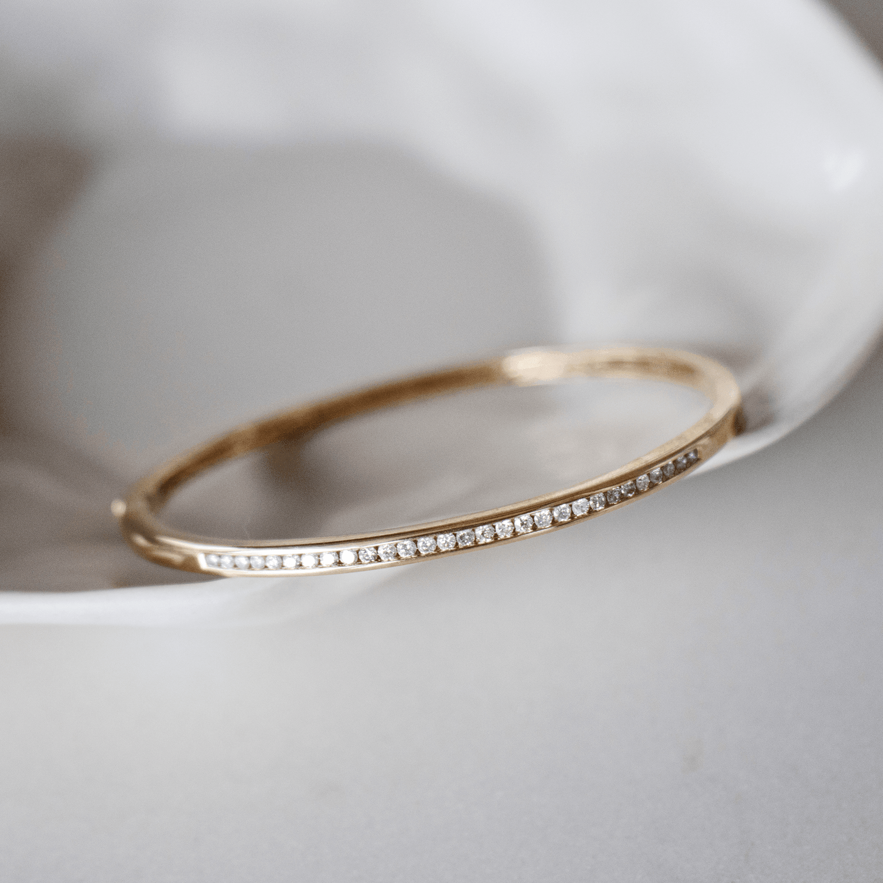 Round Brilliant Cut Channel Set Diamond Oval Bangle in 9ct Yellow Gold - Wallace Bishop