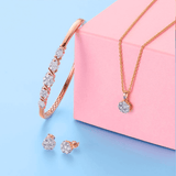 Round Brilliant Cut Diamond Cluster Pendant in Yellow Gold on a chain with a Diamond and Gold Bangle and matching earrings